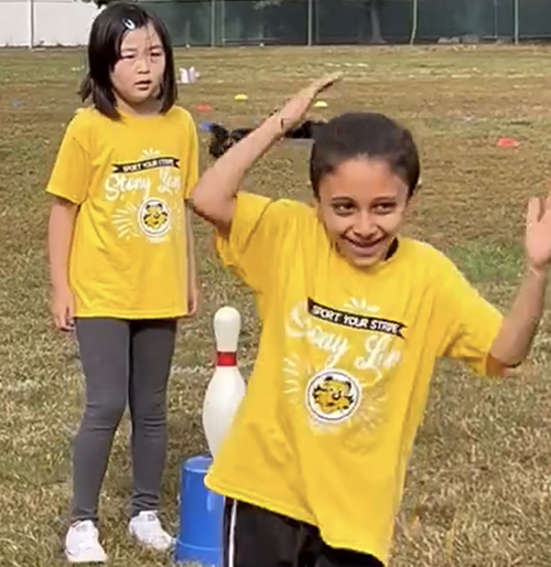 Two students having fun on the field