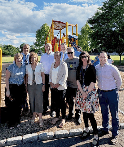 Stony Lane representatives in front of playground