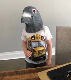Student in pigeon costume with school bus shirt